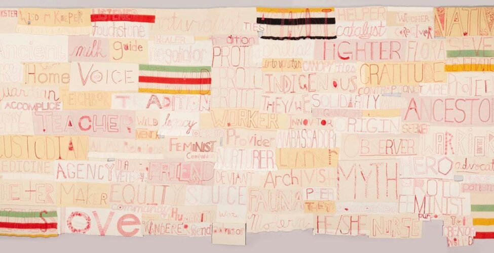 A long rectangular work composed of numerous other horizontally oriented rectangles. Each rectangle contains a word embroidered in red thread on various shades of cream to pale tan cloth in assorted stitches and styles. Some of the largest words are Ancestor, Myth, Love, Voice, Fighter, Custodian, Gratitude. Smaller words include Seeker, Care, Watcher, Legacy, Healer, Advocate, Interpreter, Wild, and Catalyst. Interspersed among the words are rectangles made of striped blankets in red, green, yellow, and black.