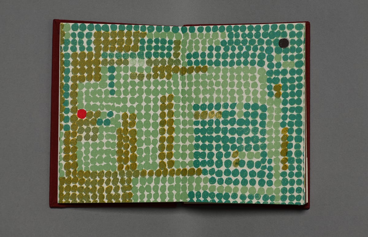 An open book with pages filled with green dots (forest) in various hues. The page on the left is filled with dots of mostly sage and olive green with a few teal dots forming geometric shapes. At right the page is filled with mostly teal and sage dots with a few olive green dots. On the left page, at far left center is a single small red dot (Little Red Riding Hood). On the right page at upper far right is a single small black dot (wolf).