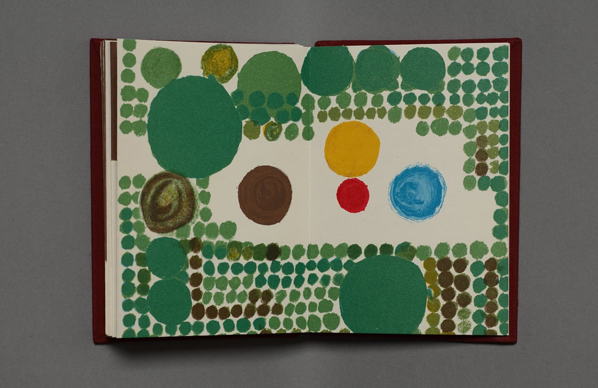 An open book showing a roughly rectangular clearing surrounded by green dots of varying sizes. In the clearing at left is a large brown dot (hunter) and large blue dot is at right (grandmother). Between these two are a large mustard yellow dot (mother) stacked over a smaller red dot (Little Red Riding Hood). The surrounding green dots (forest) range in size from very small to twice as large as the hunter, grandmother, and mother dots.