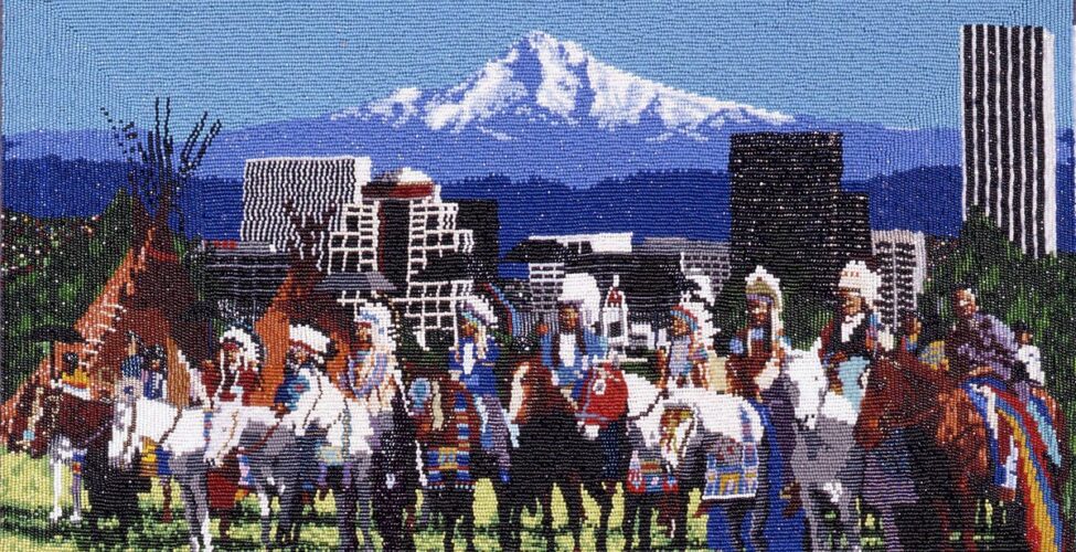 The Gathering, Marcus Amerman, 10 1/8 x 17 inches, glass beads on cotton cloth. A horizontal, rectangular work depicting a grouping of individuals on horseback arranged in a line in front of the Portland skyline with Mt. Hood in the distance. The grouping takes up the lower half of the work. They are shown on a patch of pale green grass wearing white feather headdresses and finery in blues, brick red, white and yellow. Their brown and white horses are adorned in similar colors. Just behind the group on the left are 2 brown tipis. The cityscape in the middle ground is composed of geometric buildings beaded in gray, white and black set against the blue and white mountains and blue sky in the upper half.