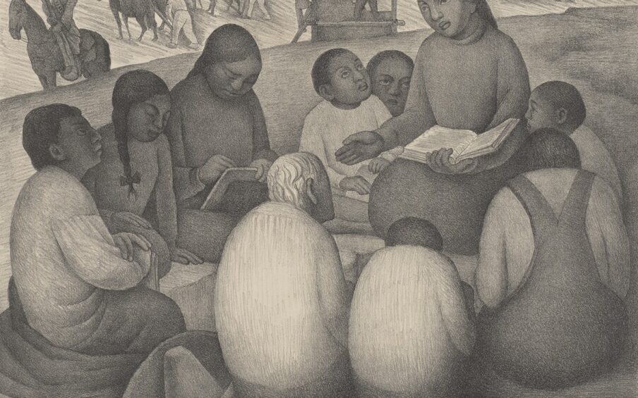 Image description: Diego Rivera, La Escuela de Aire Libre (Open Air School), 12 1/2 x 16 5/16 inches; sheet: 15 3/4 x 22 3/4 inches, lithograph on cream wove paper. A landscape print rendered in shades of gray depicts a group of students, both young and old, gathered around a teacher who holds a book open on her lap. The teacher sits at left, slightly elevated above her students who gather in a circle around her. She had dark center parted hair that lays flat to her head, large eyes with a broad straight nose and full lips. She wears a simple high-necked, long-sleeved garment and holds up her right hand, palm out. Two younger students huddle near her to the left and have short, cropped hair and dark skin. Three more students are positioned at left. One is shown in profile wearing a long full sleeved shirt, cropped dark hair and has a garment or wrap gathered around him as he sits on the ground. Next to him to the right are two students, one in long braids and one in the act of writing in a book. The figures’ facial features all resemble those of their instructor. In the foreground, three students sit with their backs to the viewer. At center is a white-haired man sits hunched next to a small student and another in overalls. In the background there are two teams of horses and their drivers working the fields. At far left a guard on horseback with a rifle stands watch. At center, crops are gathered by two figures at a large rectangular container. At far right is another horse team with driver working the land. The print as a hand drawn quality, with the look of a detailed pencil sketch.