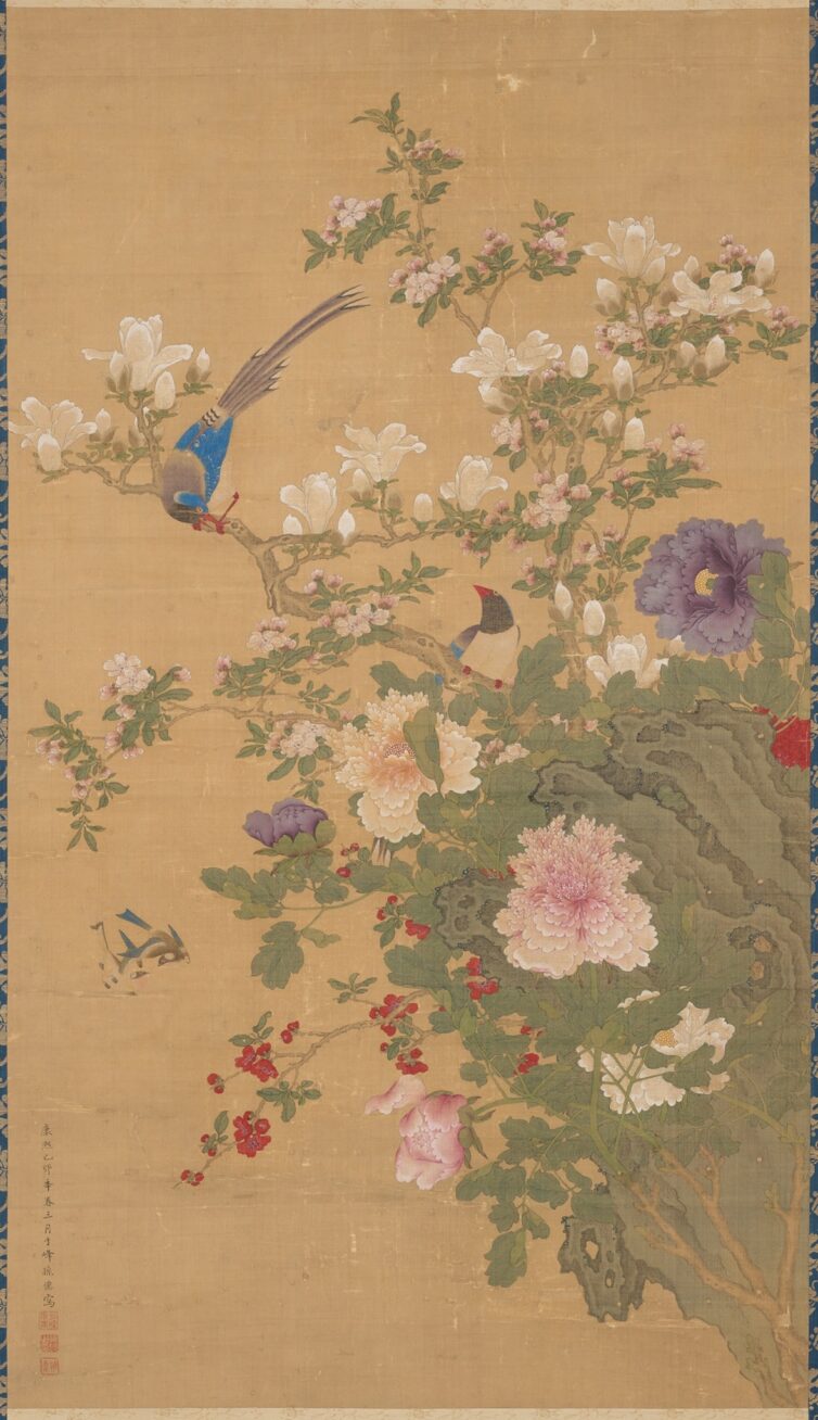 Image description: Birds and Flowers, Sun Yi, hanging scroll; ink and color on silk, painting: 48 1/2 x 27 3/4 inches; mounting; 92 1/2 x 34 inches. Detail of scroll depicting two birds perched on flowering branches. A brown bark covered branch bisects the work from upper left slanting down the lower right. A male bird grips the branch at left, grey plumed tail held high while it bows its blue capped head at its mate at lower right. Its wings are bright blue, body gray and beak, legs and feet a brilliant red. They perch among creamy white magnolia blossoms and buds, tiny pale pink crabapple blossoms and leafy greenery. A large peach magnolia blossom with its many layered, ruffled petals is at lower bottom next to a violet peony bud. The scene is set against a khaki background.