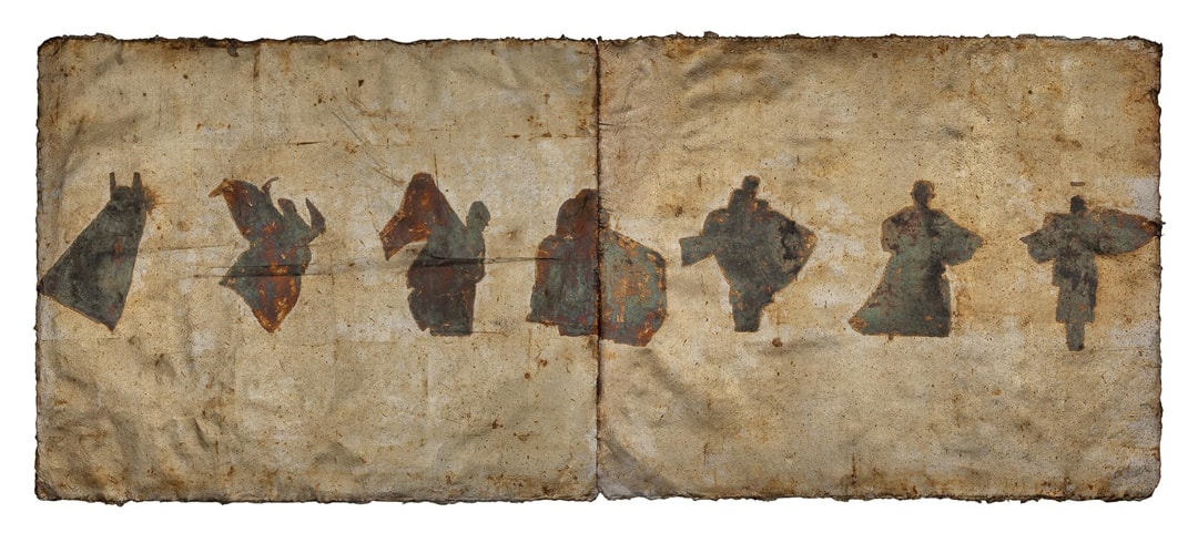 Image description: Emerging Zodiac, 2021, oxidized silver leaf and Renaissance wax on paper, 17 ⅜ x 42 in. Horizontal rectangular composition of 7 abstract human silhouettes in motion rendered in rusty brown, verdigris, purple, yellow against a blank background of 2 brownish patina paper with wrinkles and frayed or burnt edges. From left to right, the figures appear captured in motion, arms or legs outstretched and cloaked in a large garment that at times appears as wings.