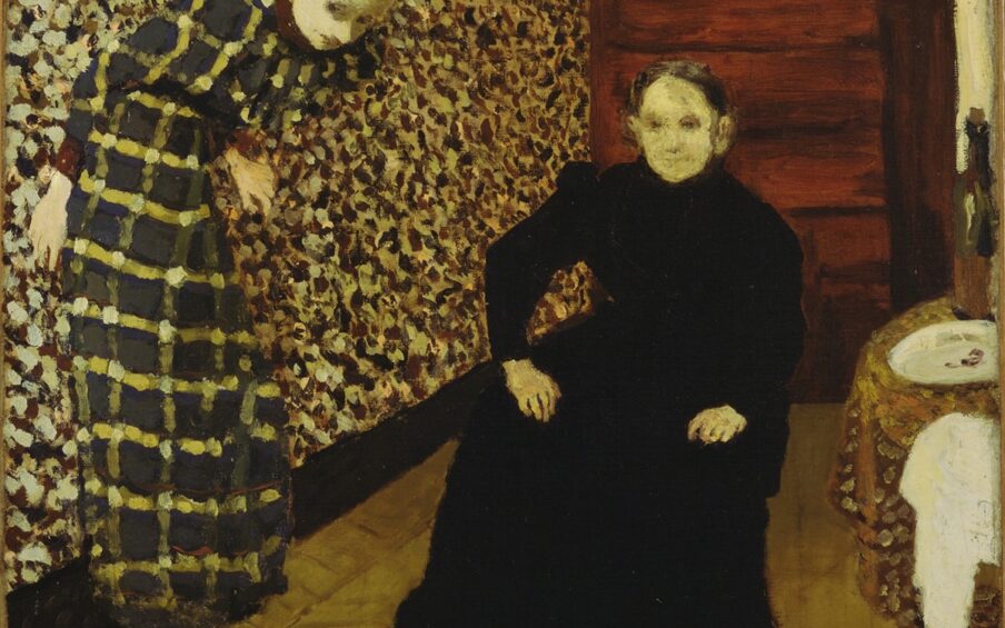 Image description: Vuillard, Interior, Mother and Sister of the Artist, 1893, oil on canvas. This painting is crowded with busy patterns and two women looking out towards the viewer. The young woman on the left wears a hunter green, yellow and white plaid dress and is leaning against the wall while bending forward at the waist as if to stay in the painting. The wall behind her is patterned of many colored splotches including white, crimson, yellow and dark green. Despite competing patterns the young woman almost blends into the wall, save for her pale face and hands. An older woman is seated on a chair in the middle of the space. She is wearing an all black dress and her pale face and hands offer contrast. The rug beneath them is a tan color and appears to have a subtle pattern to it. At the back of the room, in the corner, is a warm brown wooden dresser with drawers and on the far right of the scene, next to the seated woman is a round table covered with a brown, yellow, orange and cream patterned tablecloth. On top of the table sits a large wine bottle, an empty white plate and a crumpled white napkin.