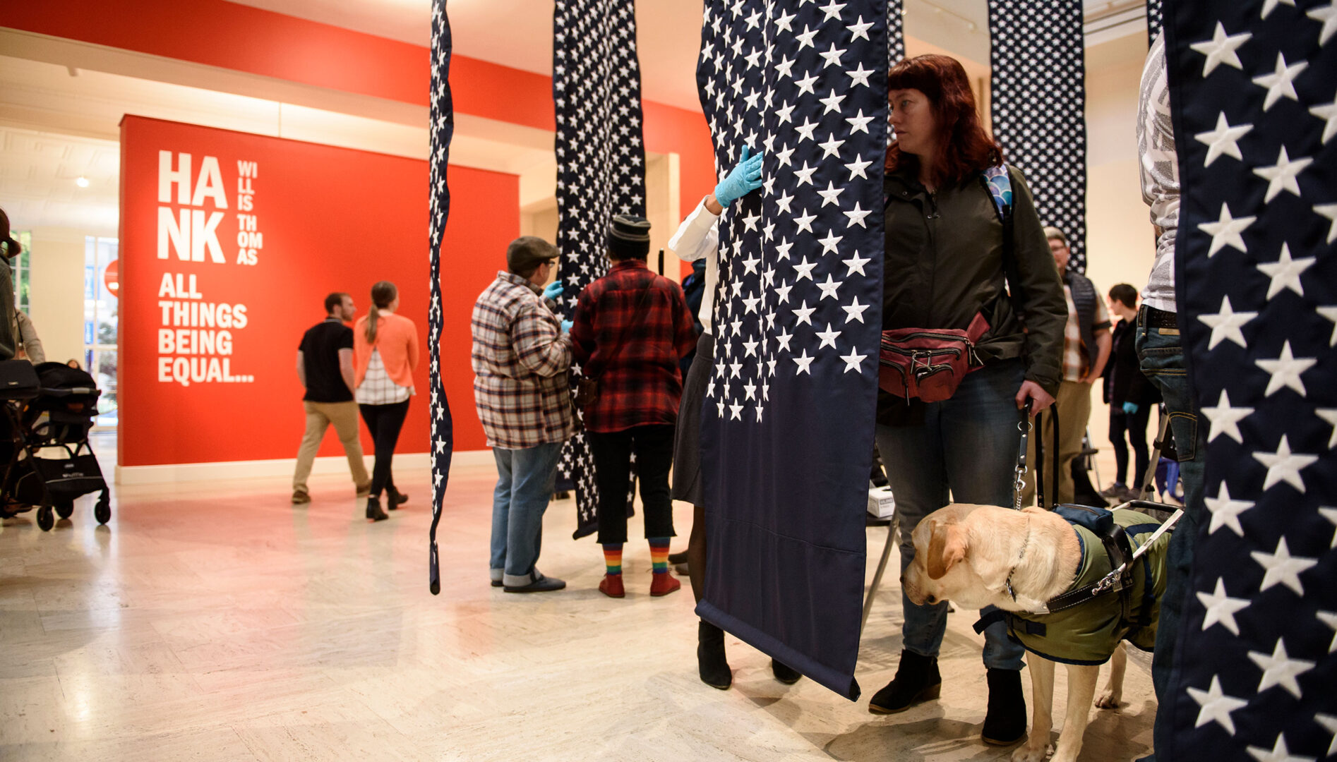Low vision and blind Museum visitors experiencing artist Hank Willis Thomas’s “14,719.”