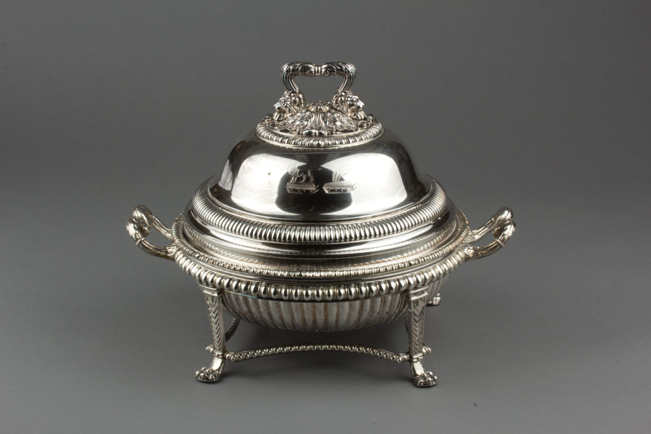 Silver vegetable dish with cover and stand.