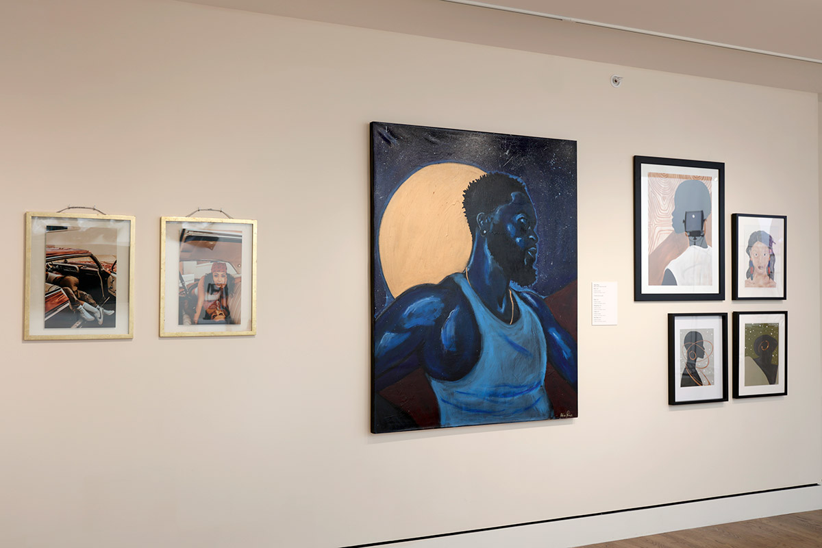 A gallery wall with framed artworks