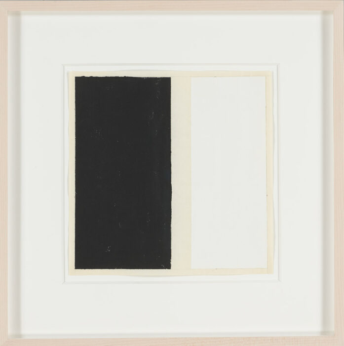 Drawing of a black rectangle on the left and a white rectangle on the right, on off-white paper. The rectangles are surrounded by a white mat and a light colored wooden frame.