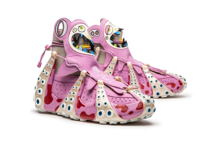 A pair of highly decorated pink sneakers