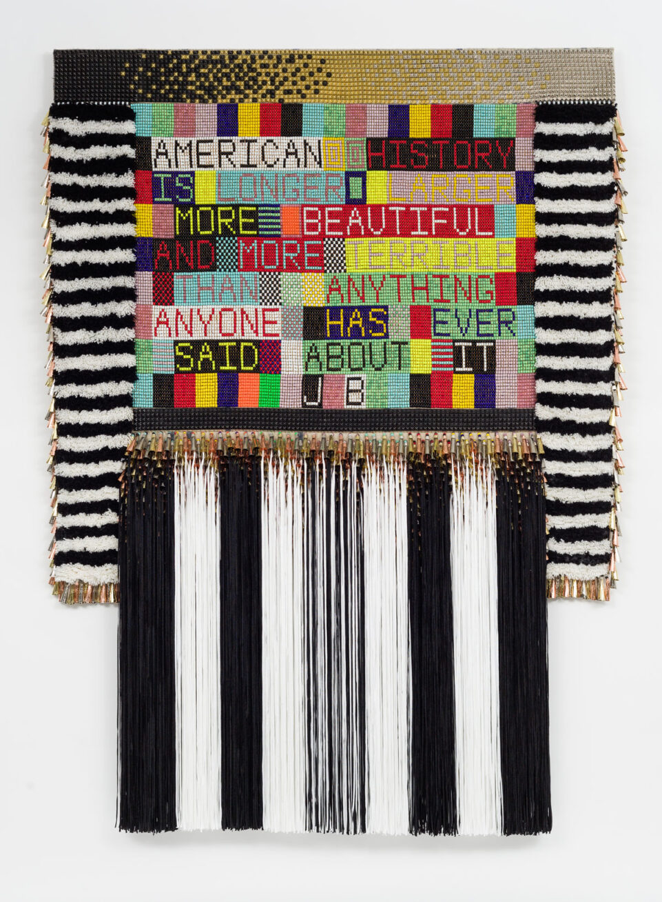 Jeffrey Gibson, AMERICAN HISTORY, 2015. Wool, steel studs, glass beads, artificial sinew, metal jingles, acrylic yarn, nylon fringe, canvas. 89 x 66 x 5 inches and 226.1 x 167.6 x 12.7 cm. Photo by: Pete Mauney.