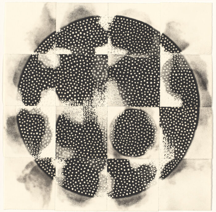 This black and white monoprint is composed of a series of 16 separate 3-inch squares assembled in four rows of four squares each with the white background forming a border around the whole assemblage. In a mosaic-like arrangement, the 16 white squares make up one larger square that forms a central image of a circle. Smoky greyish black shadows emanate from each edge of the circle. Most of the individual squares making up the circle are printed with black shapes that almost resemble jigsaw pieces. On the near bottom right side, a full circle appears in one of the squares, in contrast to the jagged forms in the other squares. The black forms are broken up with tiny white polka dots. While some dots appear flat against the dark background, other dots appear as if embossed with raised edges.