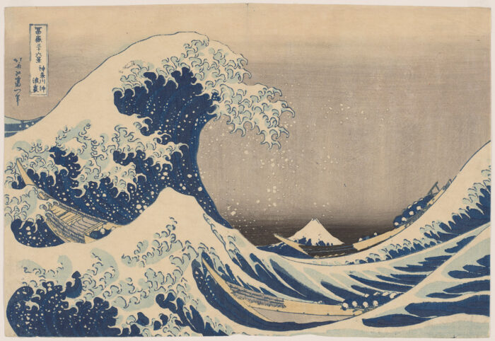 Woodblock print of a stormy sea with a big wave cresting and a smaller wave in the foreground