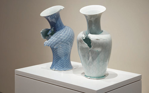 Two vases with purposeful imperfections glazed in different shades of blue
