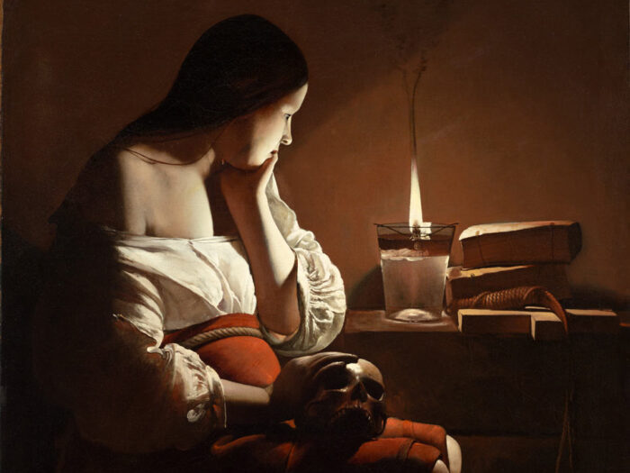 Painting of a woman in a dark room with her face lit by a candle. She is wearing a white off the shoulder blouse and a red skirt over a pregnant stomach, and holding a skull.