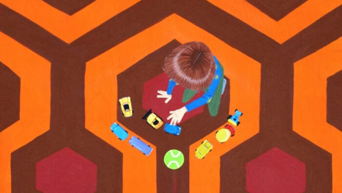Illustration of a child playing with toys on an orange and red carpet, pictured from above