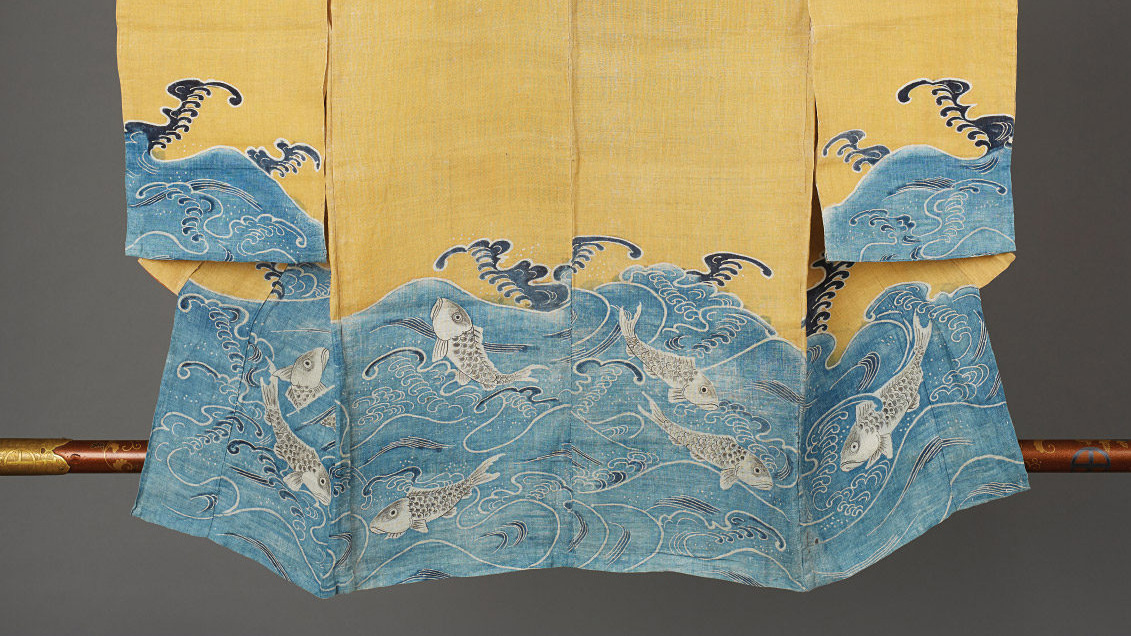 Photograph of the bottom of a kimono with blue waves and fish