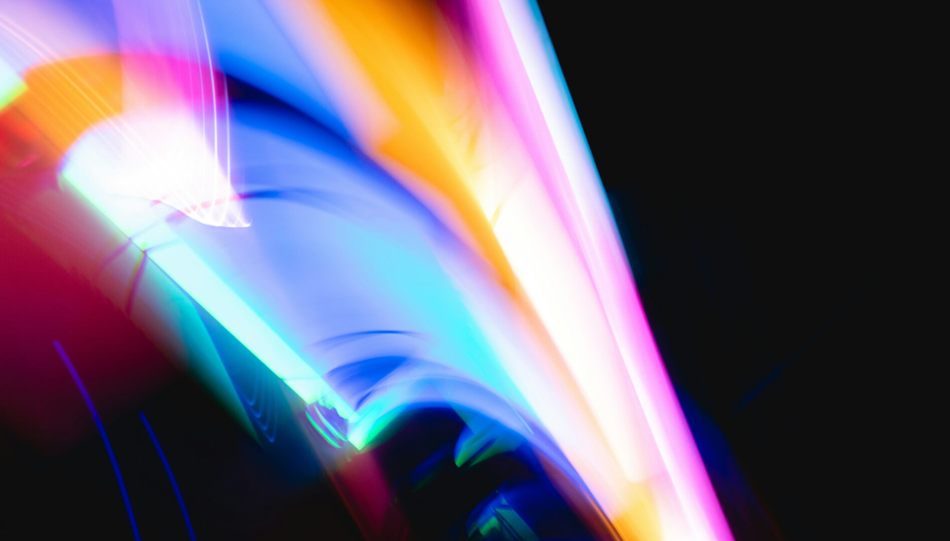 Abstract images of multicolored lights on a black background