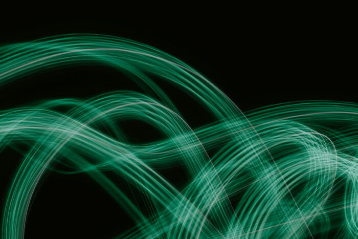 Abstract green lines on a black background