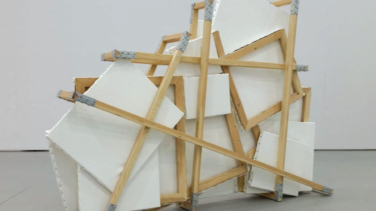 Photo of a sculpture made of wood and canvases and metal brackets