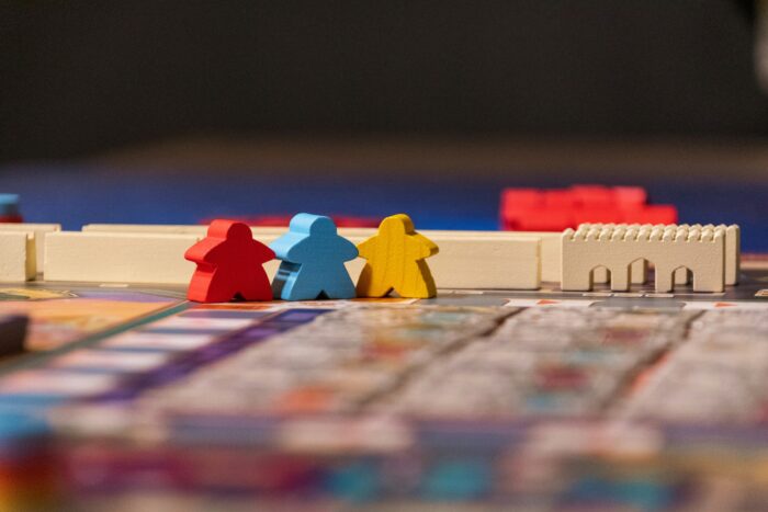 Photo of a board game with small human and buildings