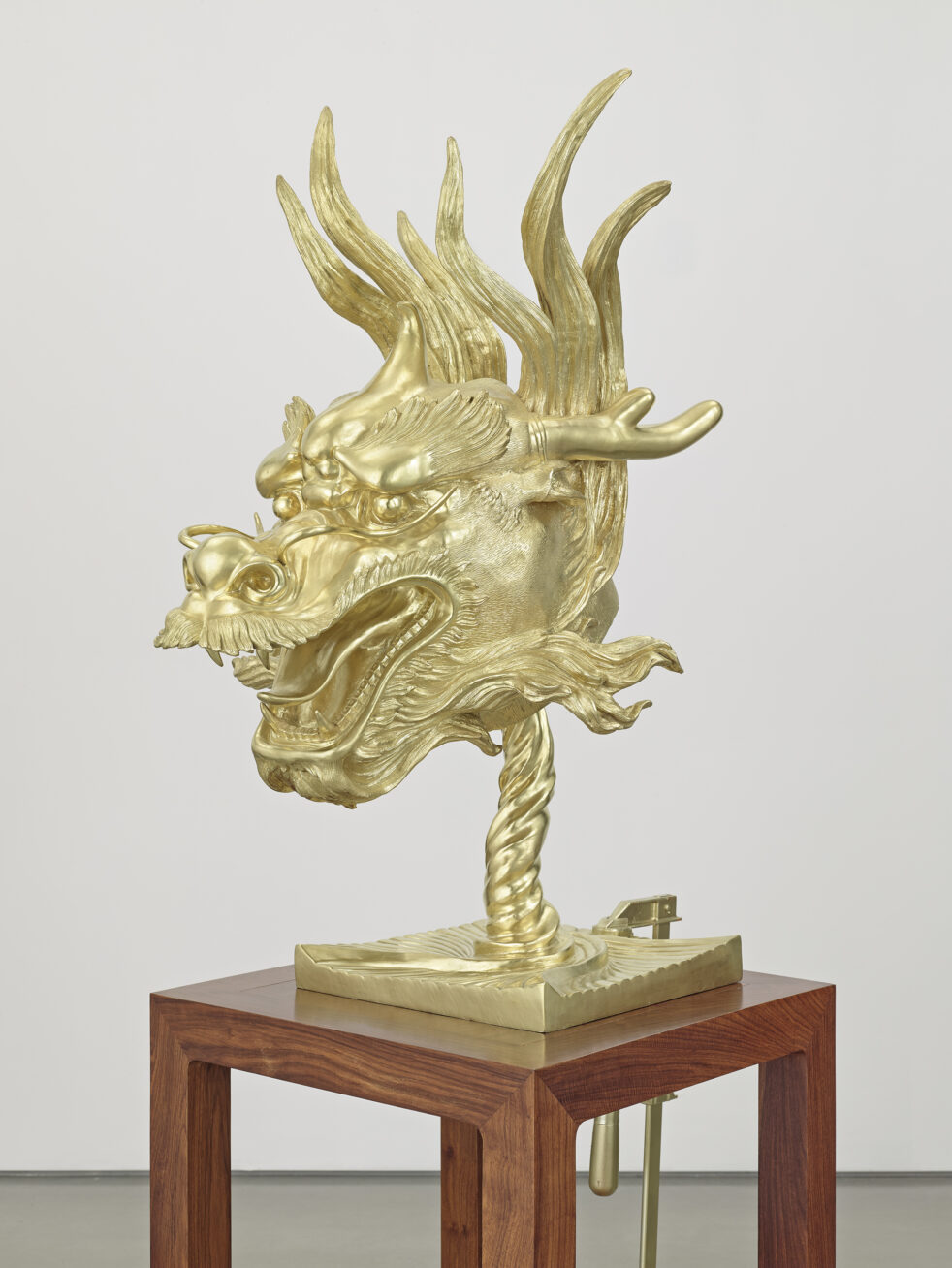Photograph of a sculpture of a golden dragon head