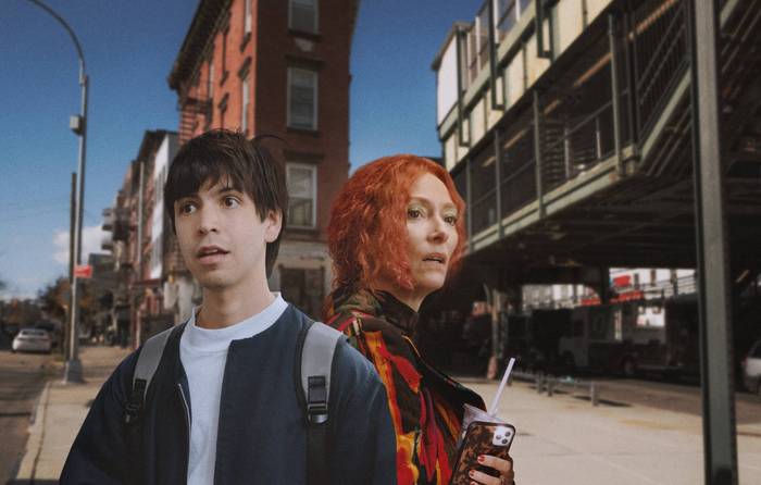 Photo of Julio Torres and Tilda Swinton standing outside on a city street