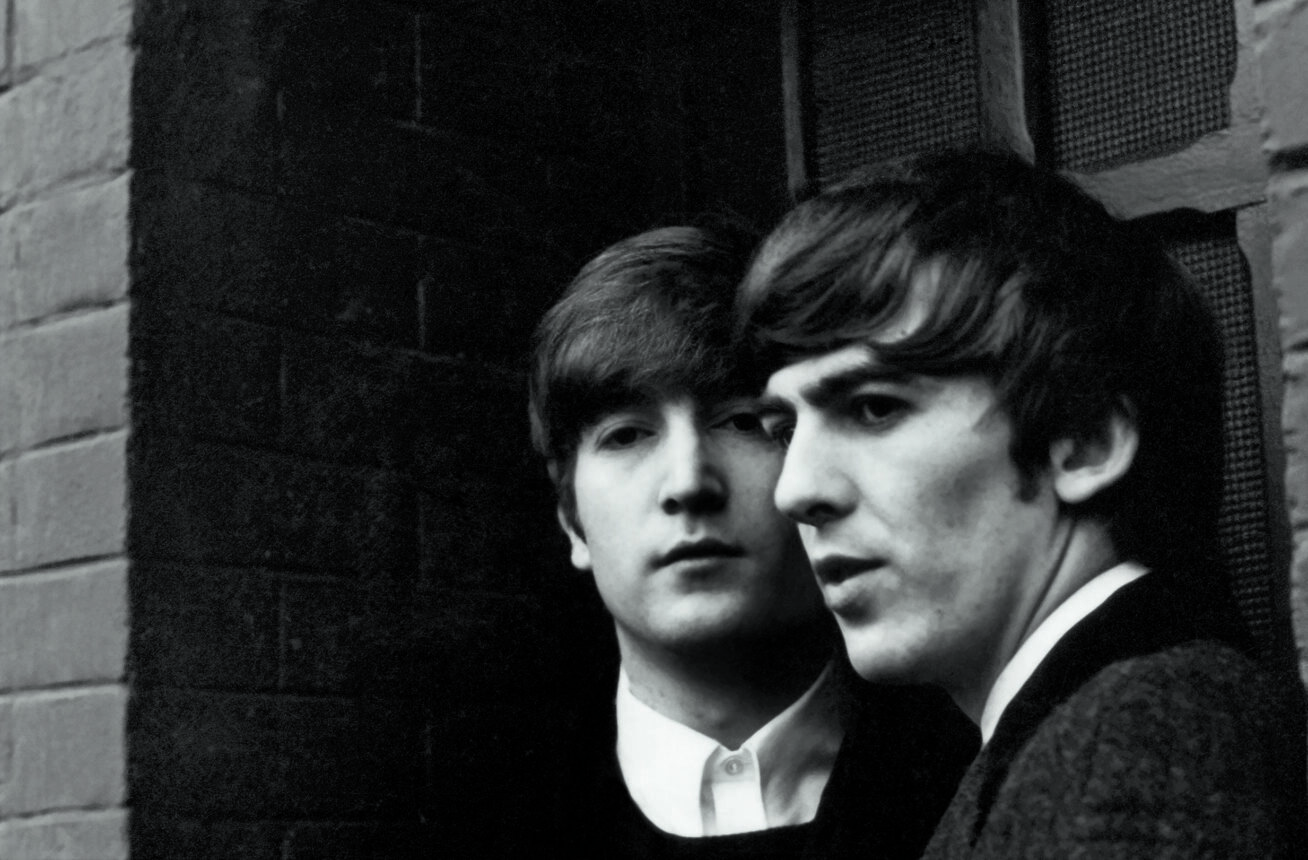 Black and white photo of John Lennon and George Harrison