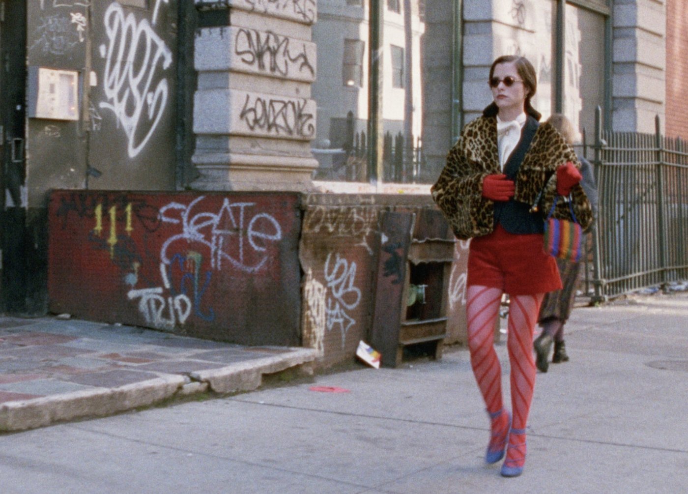 Photo still from Party Girl: Parker Posey walking down a New York City street