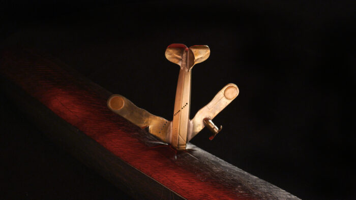 Photo of a wooden plane with a dark background