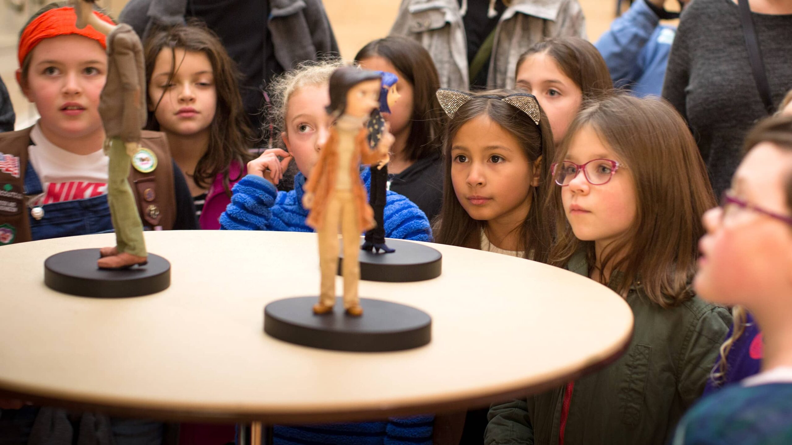 A group of children looking at animation models.