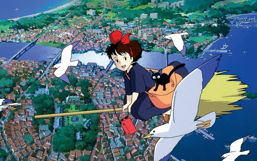 Film still of a girl riding in the air on a broomstick over a city, with birds flying to either side of her