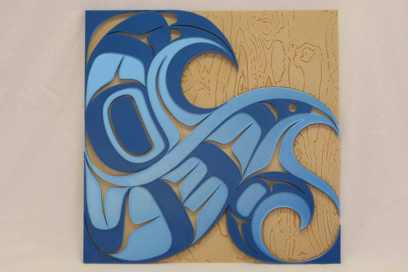 3-D relief of indigenous designs combined to form a bird that resembles a series of waves.
