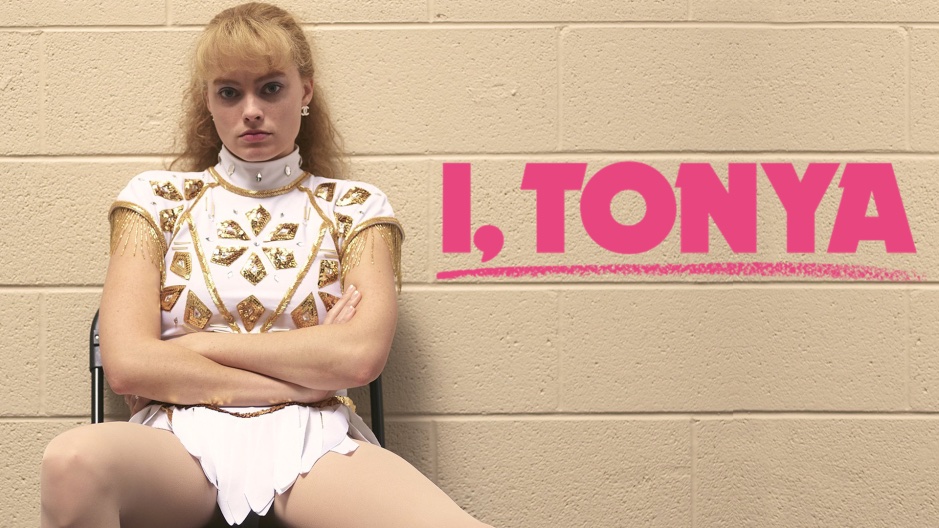 Photo of a blond woman in a white ice skating outfit sitting in front of a beige concrete wall with her arms crossed. The words "I, Tonya" are in pink to her left.