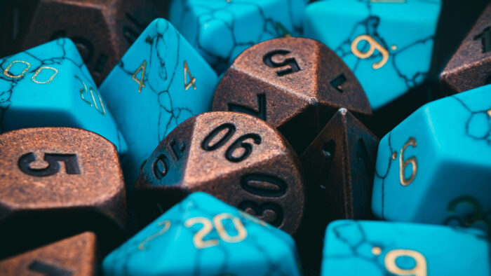 A group of bronze and turquoise gaming dice