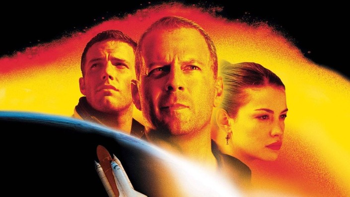 The faces of two men and a woman looking off into the distance with a bright orange background behind them and a planet and spaceship in the lower left corner.