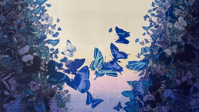 A print of purple and blue tinted butterflies