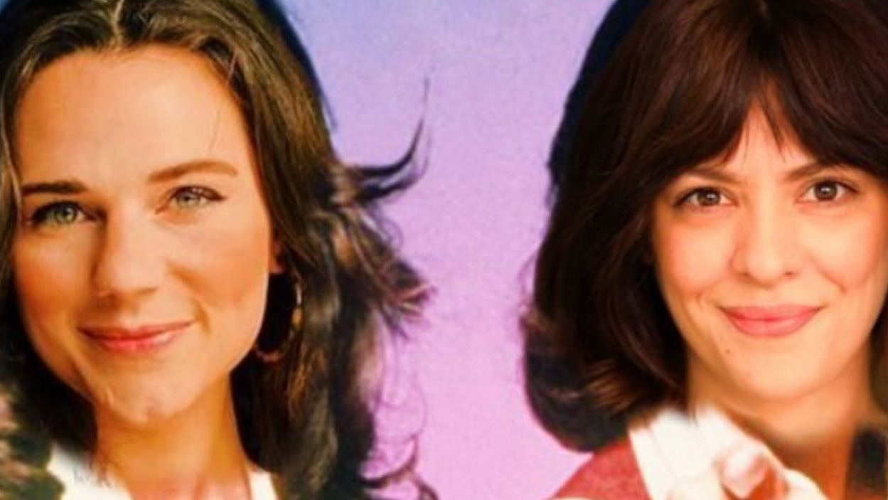 A photo of two smiling white women's faces with a purple background