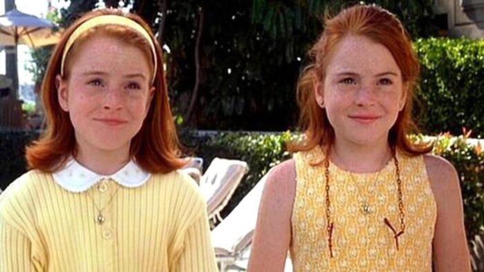 Film still of two identical twin girls with red hair
