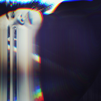 Sideways photo of a woman with an effect like her face is blurring to the bottom edge of the frame.