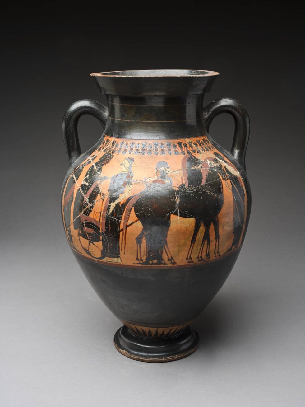 A terracotta amphora with several figures.