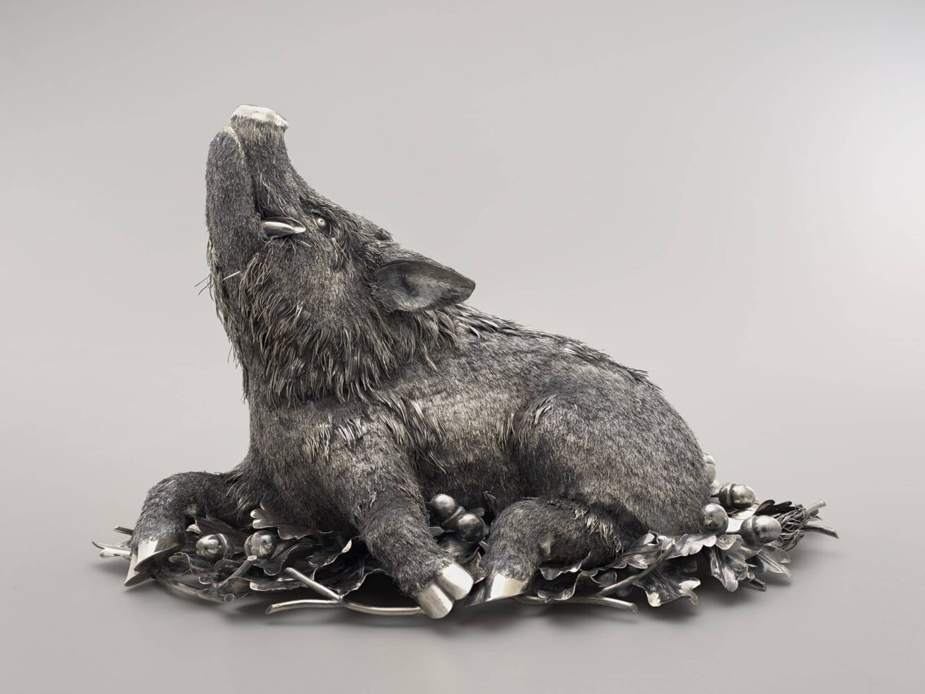 Silver sculpture of a boar.