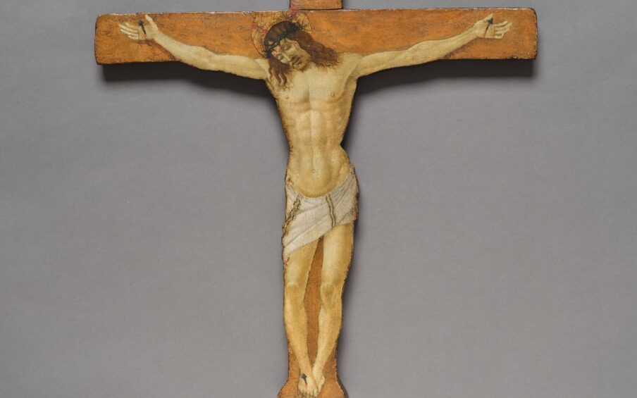 A painting of Christ's crucifixion on a wooden cross.