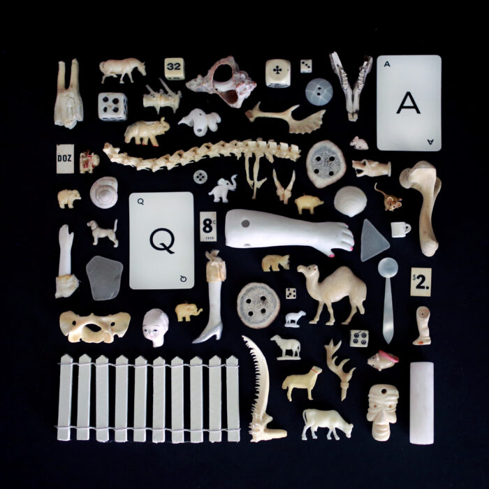Photo of a collection of white and off-white objects on a black background