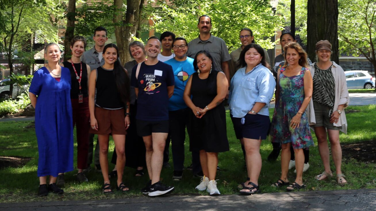 A group of people standing in a park.