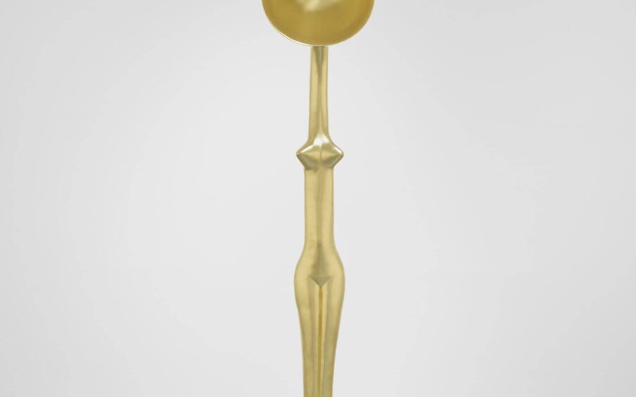 A figurative gold sculpture.