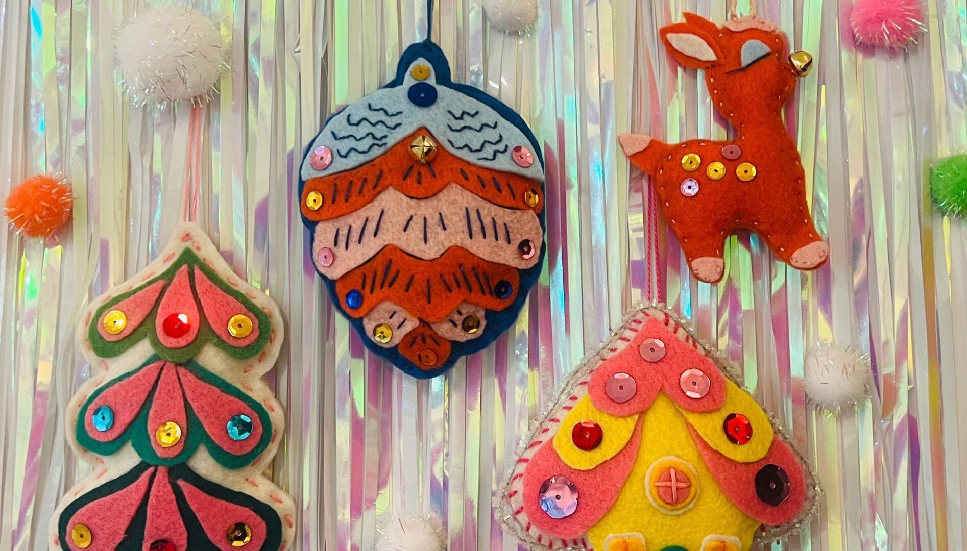 Photo of handmade ornaments against a sparkly tinsel wall