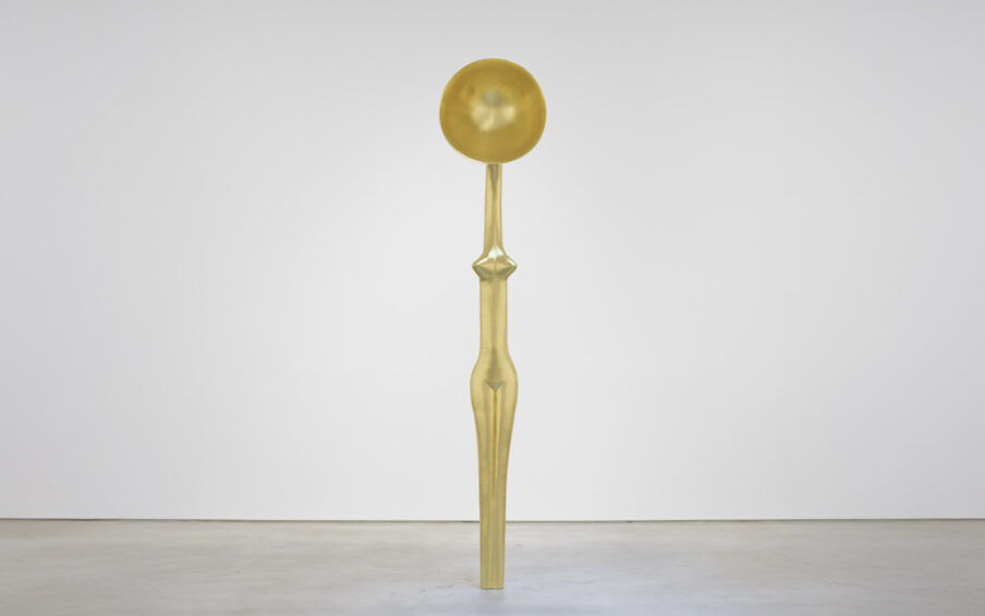 A figurative gold sculpture.