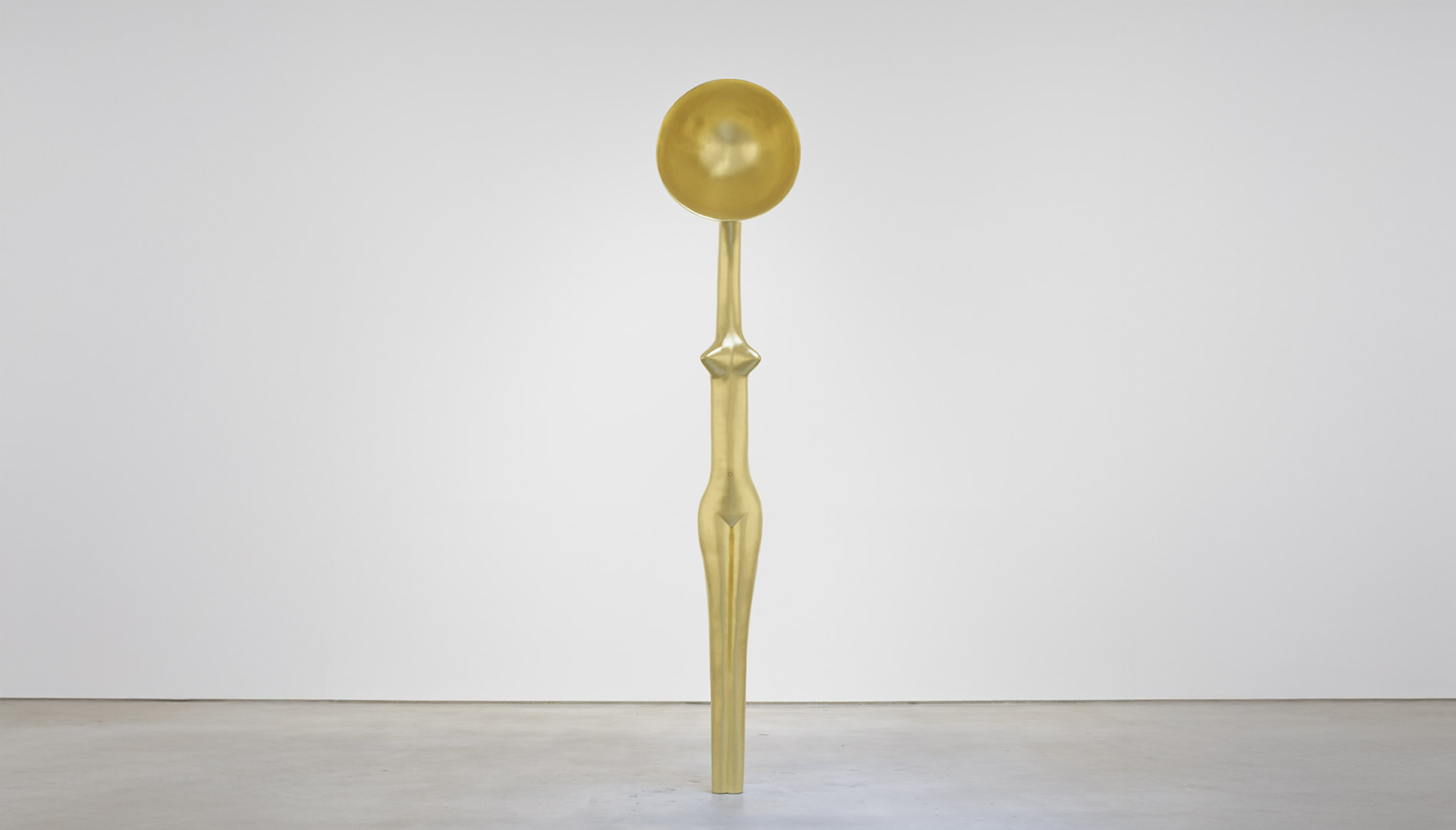 A figurative gold sculpture.