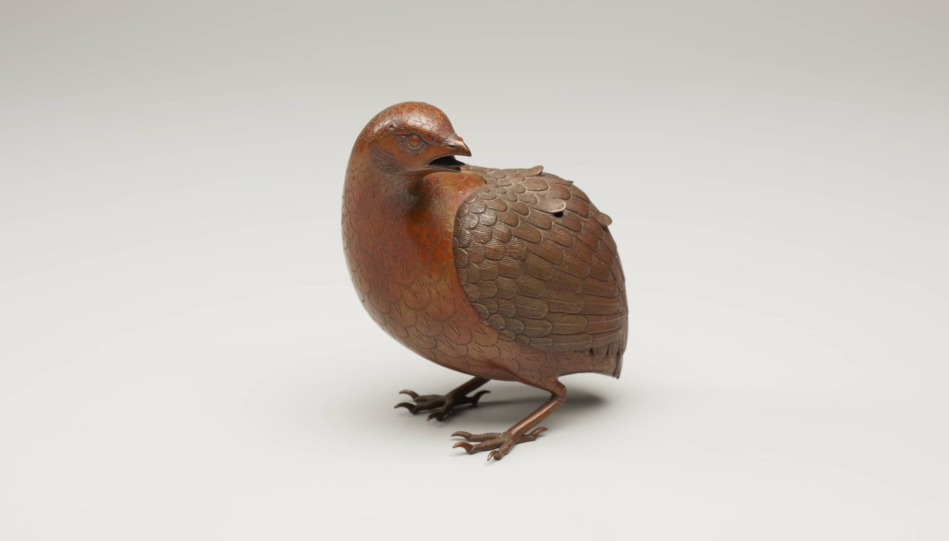 Brass incense burner in the shape of a quail.