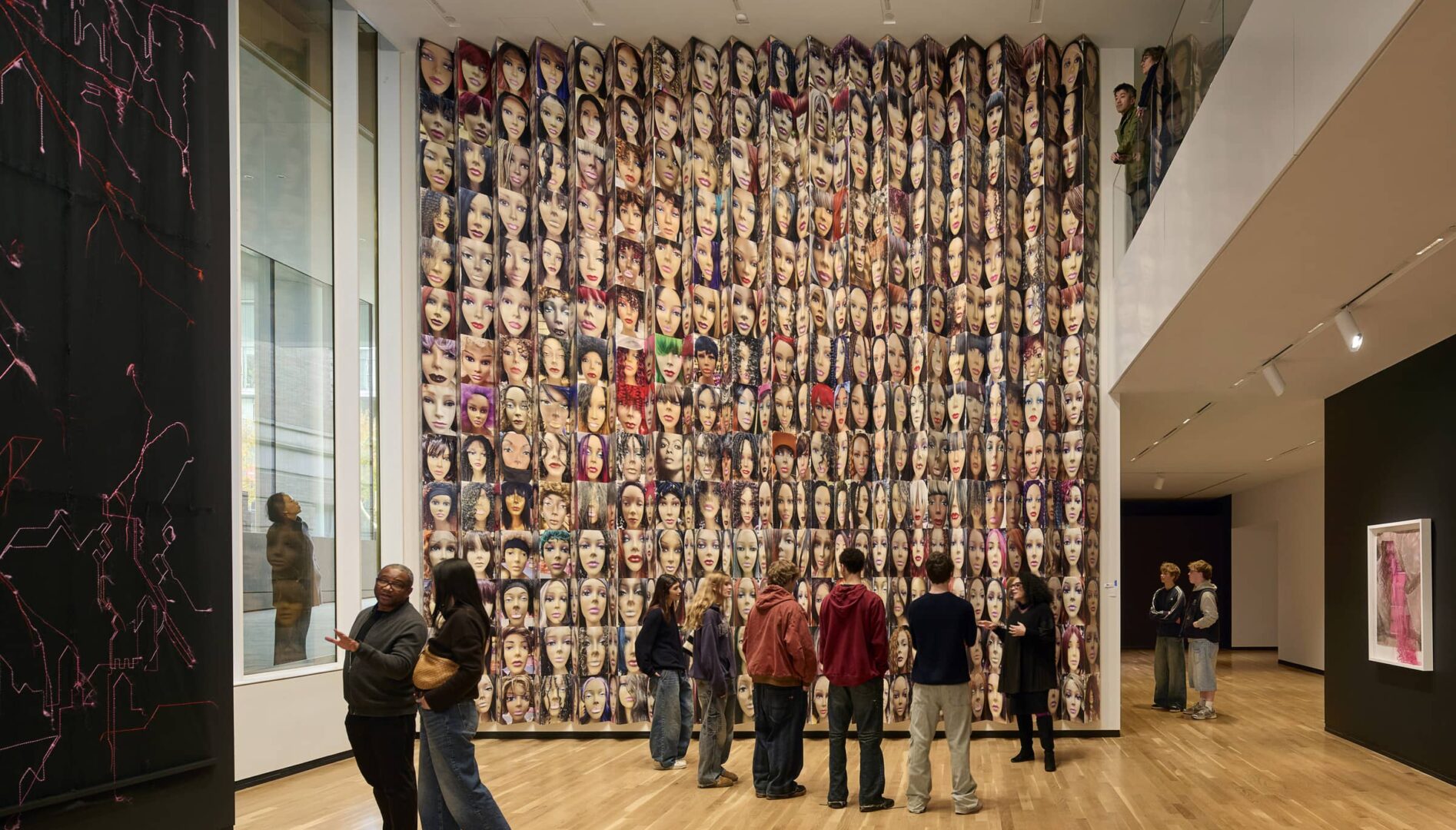 Small groups of people standing in a gallery.